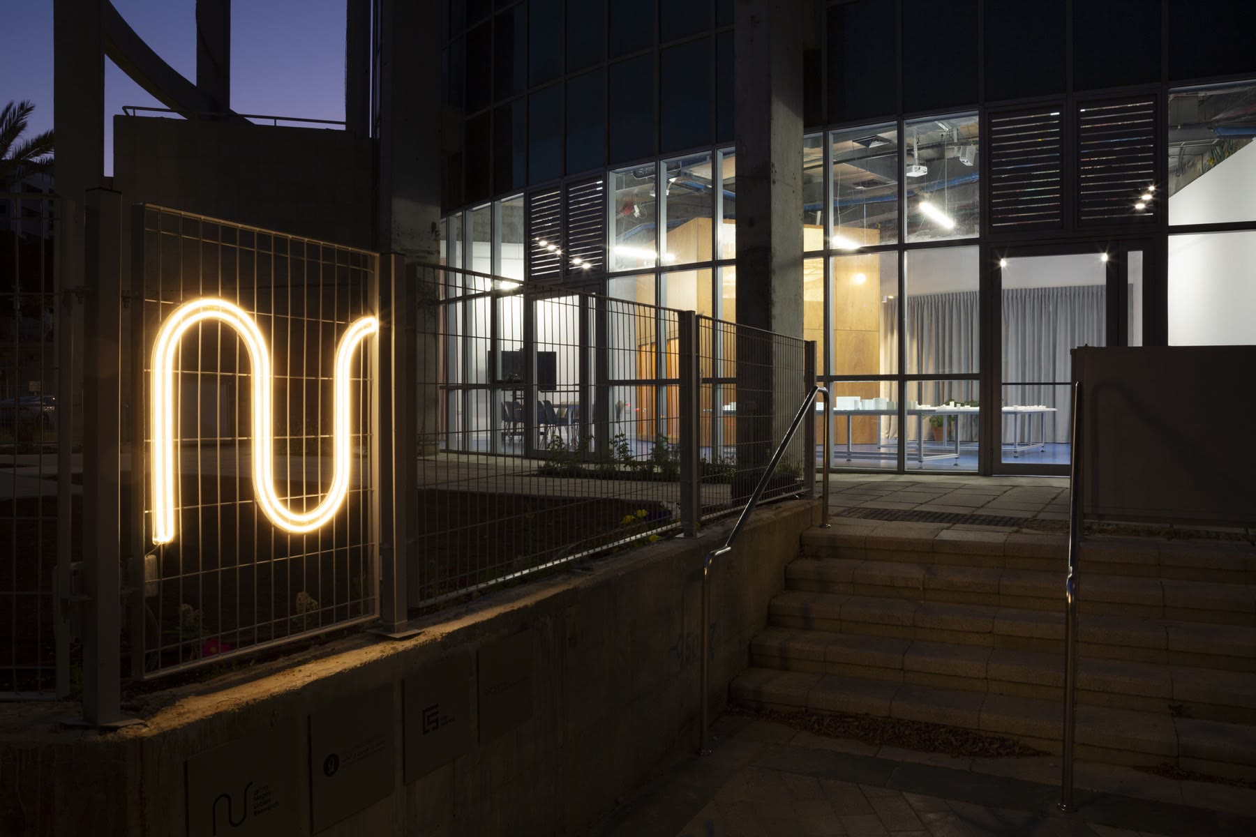 NUR lab exterior with illuminated logo