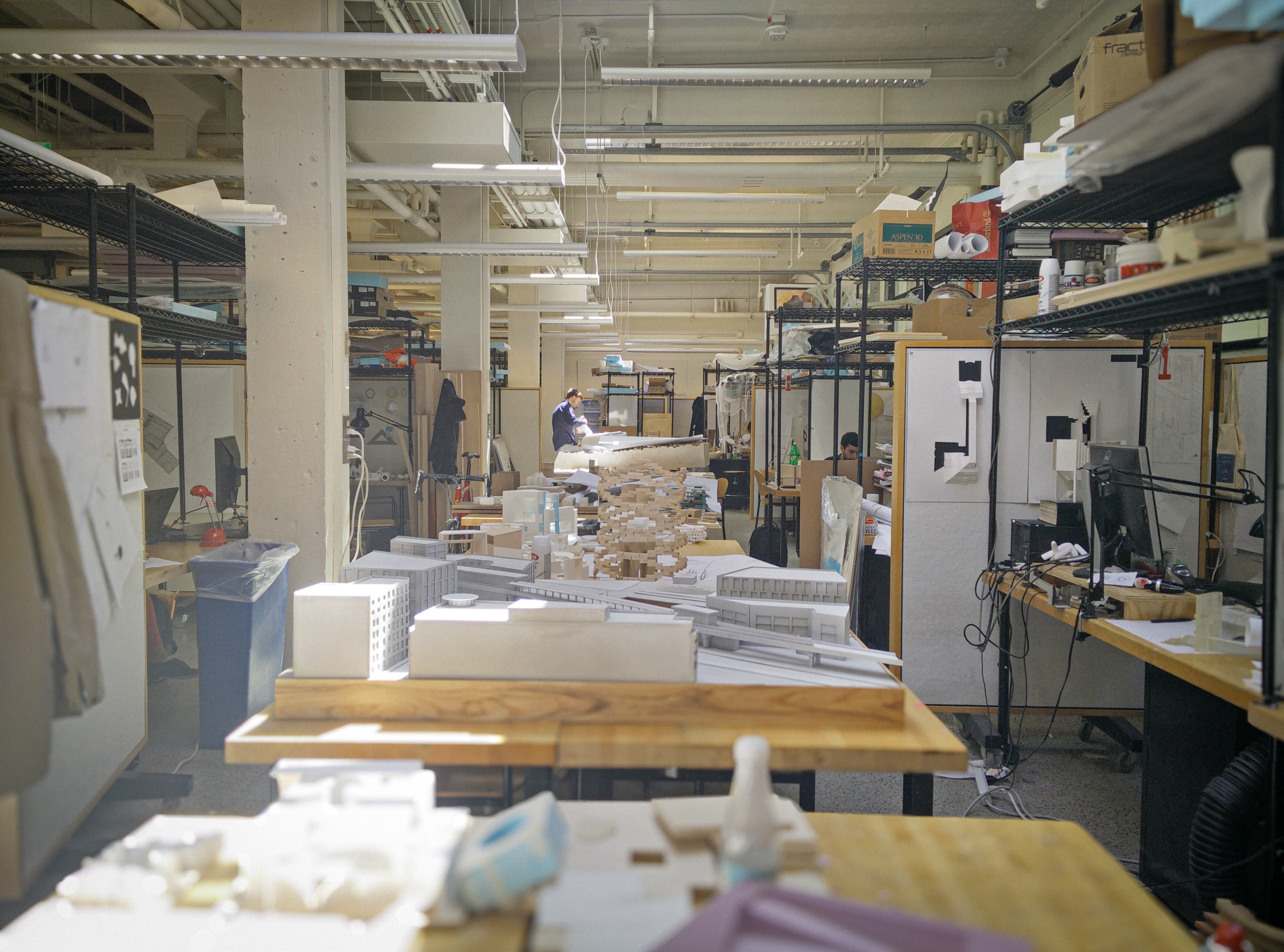 Architecture studio workspace with students and project materials